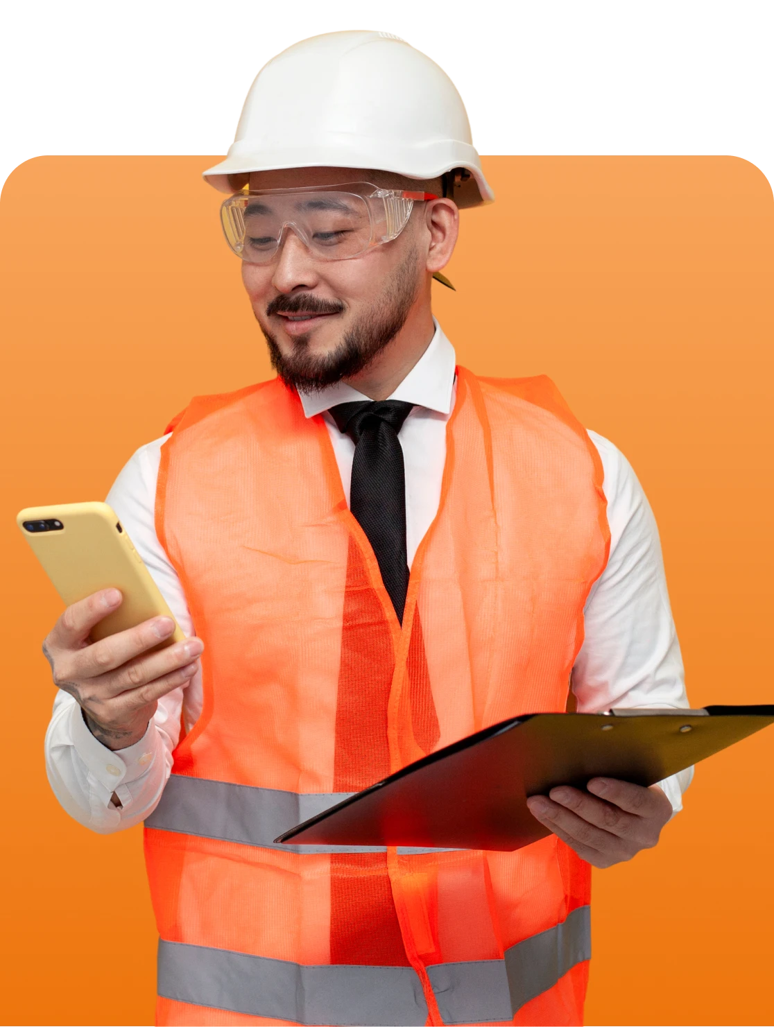 Construction worker checking phone and clipboard
